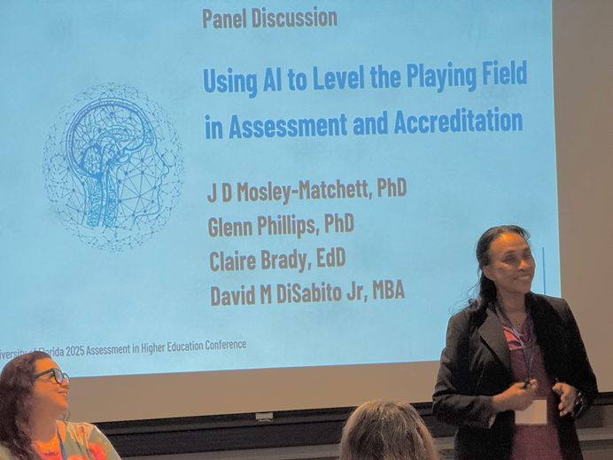 Photo of presenters at the 2025 University of Florida Assessment in Higher Education Conference. Presentation Title: Using AI to Level the Playing Field in Assessment and Accreditation Presenters: J D Mosley-Matchett, PhD and Claire Brady, EdD.